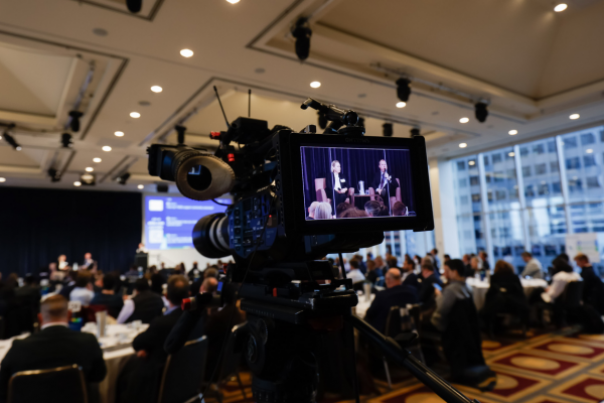 Two VicGrid staff speaking at industry event